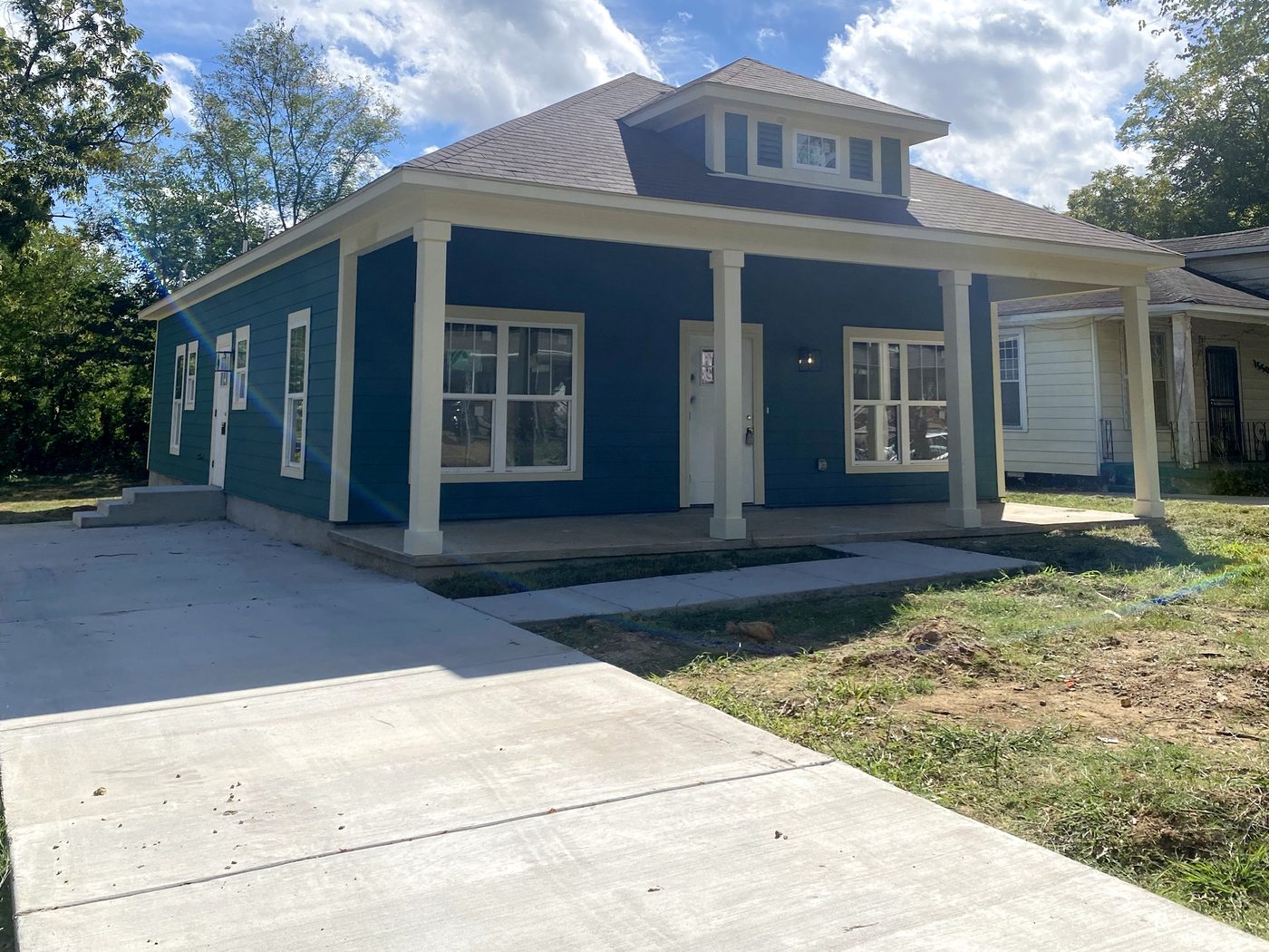 1546 Humber from the driveway, showing the porch wrapping the front of the house
