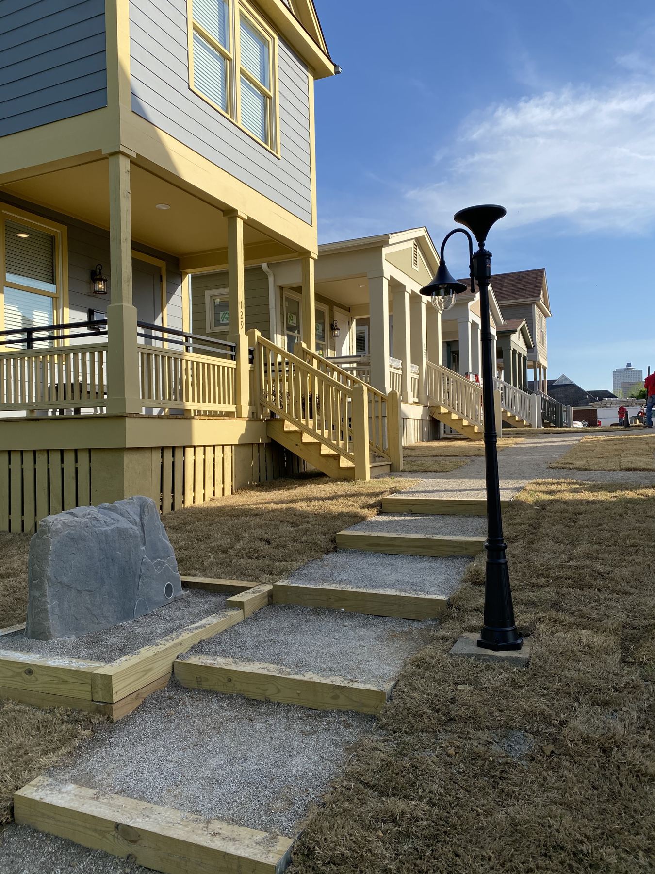Streetscape at Malone Park Commons with porches, steps, and lamp posts